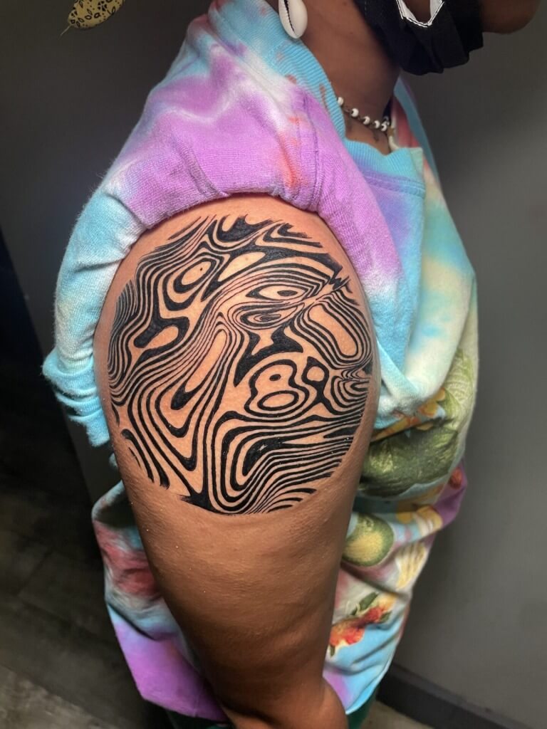 Abstract tattoo inked by Lyric, The Artist at Iron Palm Tattoos & body Piercing in downtown Atlanta. Walk-Ins are accepted. Call 404-973-7828 or come by for a free consultation.