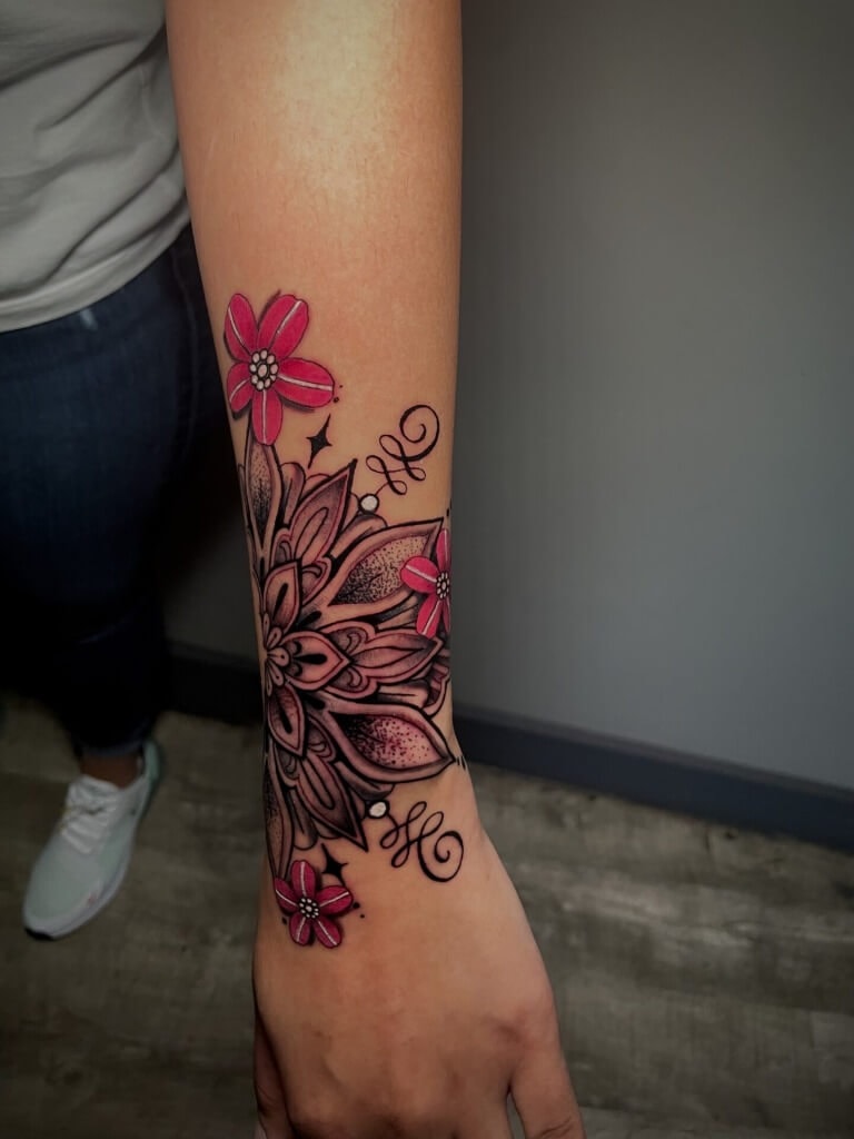 Flower mandala tattoo by Lyric The Artist at Iron Palm Tattoos & Body Piercing in downtown Atlanta, GA. We're open late night til 2AM most nights. Call 404-973-7828 or stop by for a free consultation.