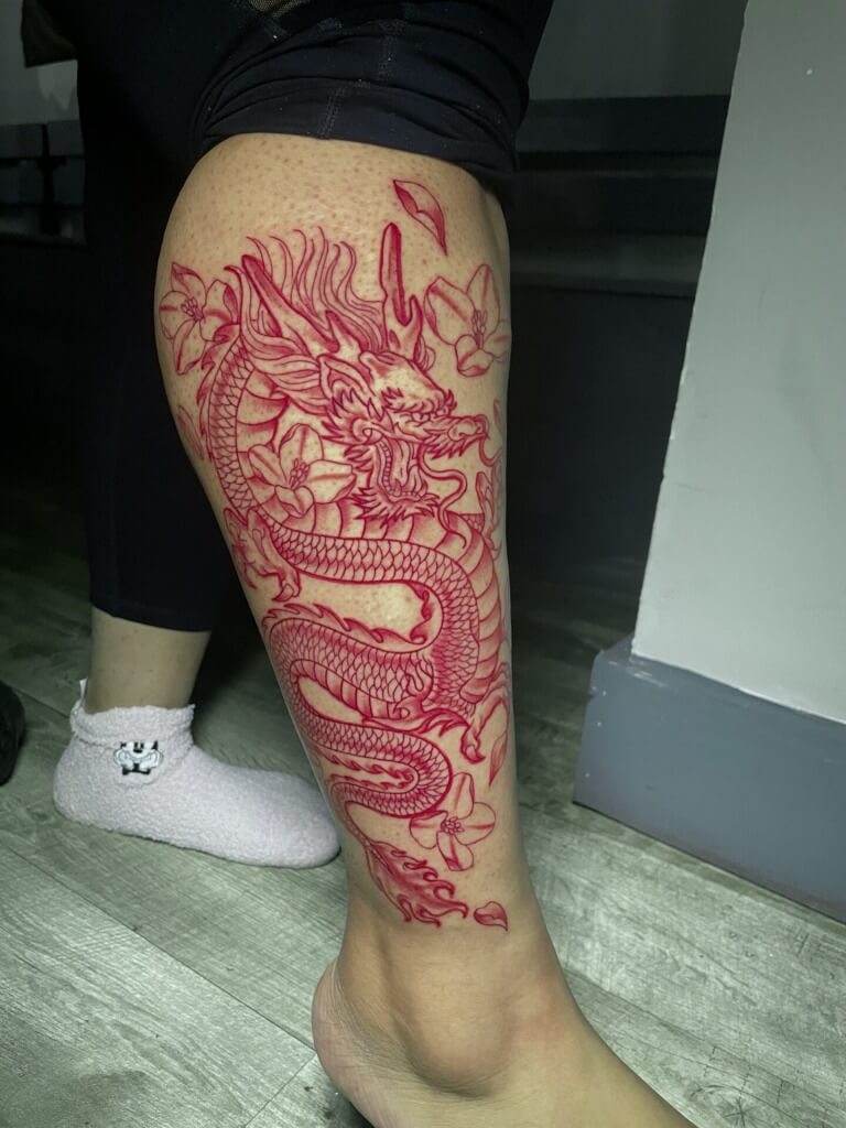 Red dragon animal tattoo inked by Lyric at Iron Palm Tattoos & body Piercing in downtown Atlanta's castleberry district. Call 404-973-7828. Walk-Ins welcome.