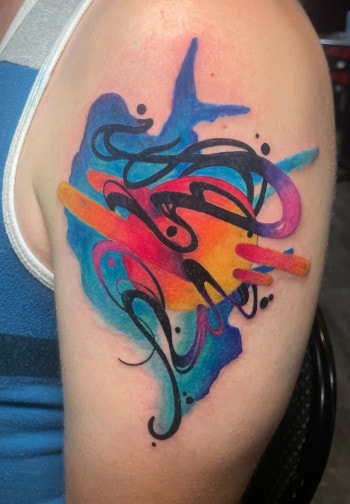 Water color tattoo by female tattooer Paper Airplane Jane at Iron Palm Tattoos in Downtown Atlanta, GA. Call 404-973-7828 or stop by for a free consultation to book Jane.