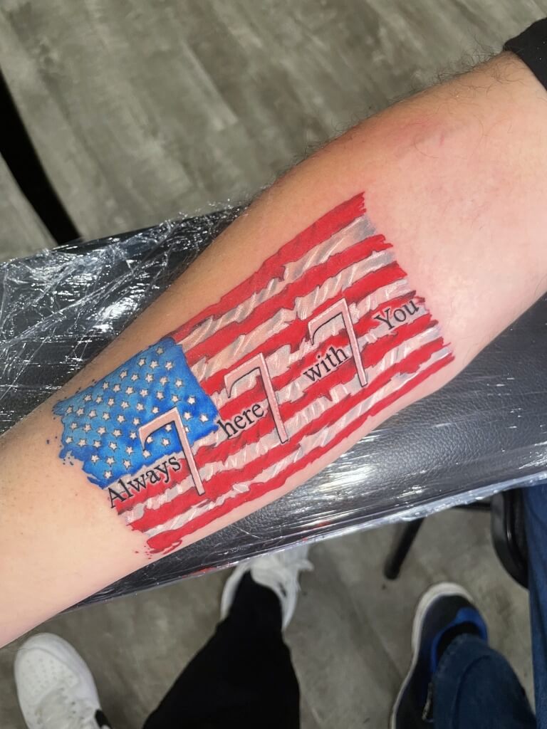 American flag guardian angel '777' tattoo in red, white, & blue designed and inked by Lyric The Artist at Iron Palm Tattoos & Body Piercing in downtown Atlanta. Call 404-973-7828 or stop by for a free consultation. Walk-Ins welcome.