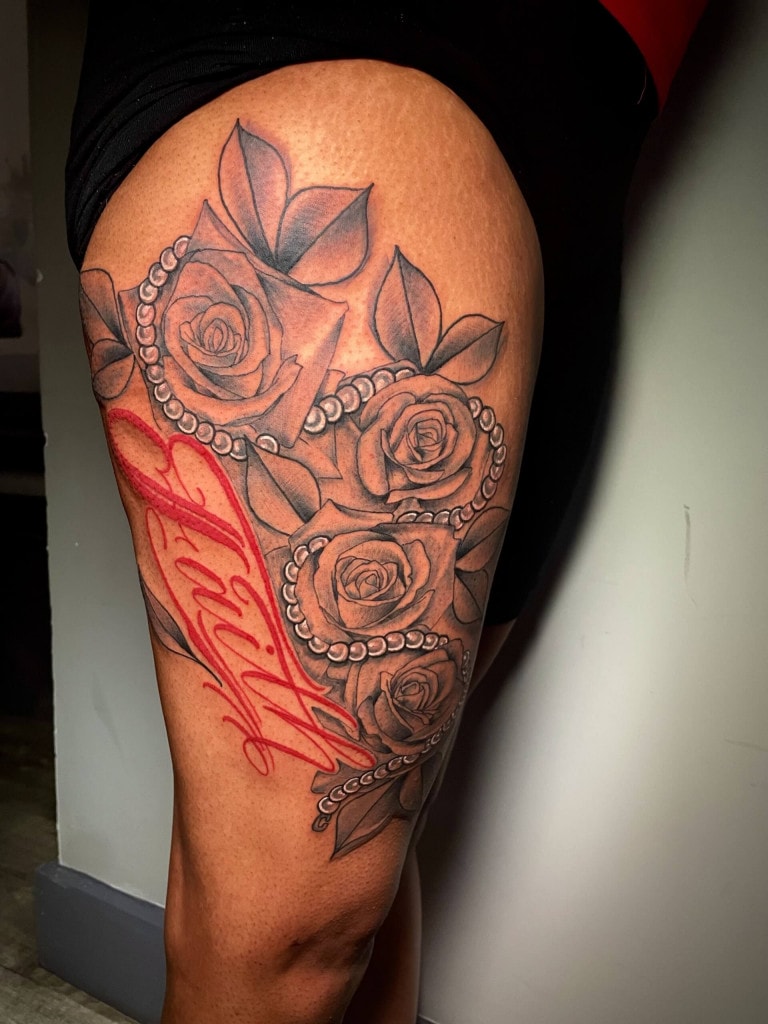 Beautiful red floral script tattoo (lettering) by Lyric The Artist at Iron Palm Tattoos & Body Piercing in downtown Atlanta, GA. Lyric is one of the most creative tattoo artists in the southeastern United States. We're open late night til 2AM most nights. Call 404-973-7828 or stop by for a free consultation. Walk-Ins are welcome.