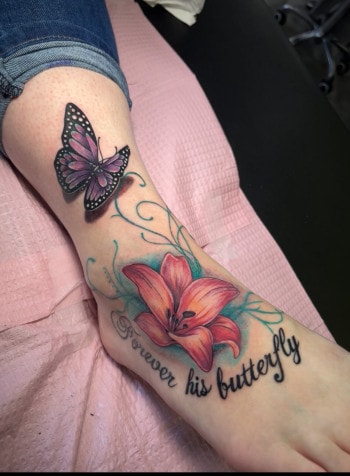 Butterfly Insect And Flower Tattoo With Color and letter script designed and inked By Paper Airplane Jane Of Iron Palm Tattoos. We're open late night until 2 A.M. Call 404-973-7828 or stop by for a free consultation.