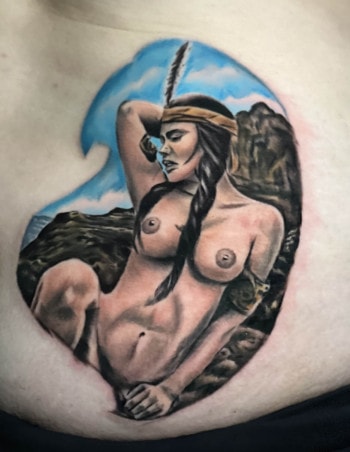 Native American woman portrait tattoo for a client by DB. Wyte. We love the likeness and the beautiful background using the limited color palette. Call 404-973-7828 or stop by for a free consultation. Walk-Ins welcome.