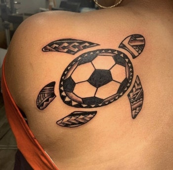 Tribal Turtle Tattoo With a Soccer Kickball In Black & Grey By Mo8 at Iron Palm Tattoos in downtown Atlanta, GA. The client wanted to get a tribal tattoo as part of her family tradition. We're open late night until 2AM. Call 404-973-7828 or stop by for a free consultation. Walk Ins are welcome.