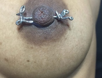 Love Barbell Nipple Piercing Jewelry installed at Iron Palm Tattoos & Body piercing in Atlanta Georgia. Call 404-973-7828 or stop by for a free consultation with a Iron Palm piercer. Walk-Ins are always welcome.