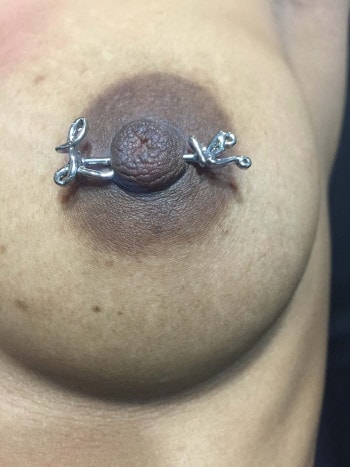 Love Barbell Nipple Piercing Jewelry installed at Iron Palm Tattoos & Body piercing in Atlanta Georgia. Call 404-973-7828 or stop by for a free consultation with a Iron Palm piercer. Walk-Ins are always welcome.