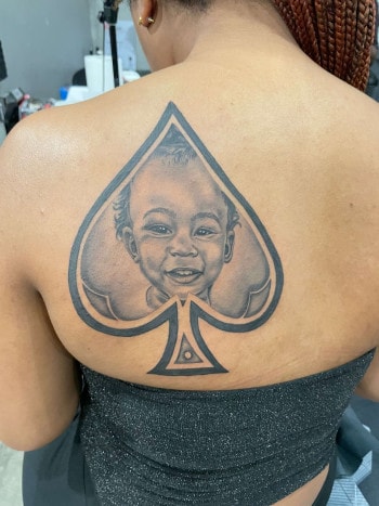 Baby Girl Photo Realistic Portrait Tattoo By T Sawyer At Iron Palm Tattoos In Downtown Atlanta. Call 404-973-7828 or stop by for a free consultation with a tattoo artist. Walk Ins are welcome.