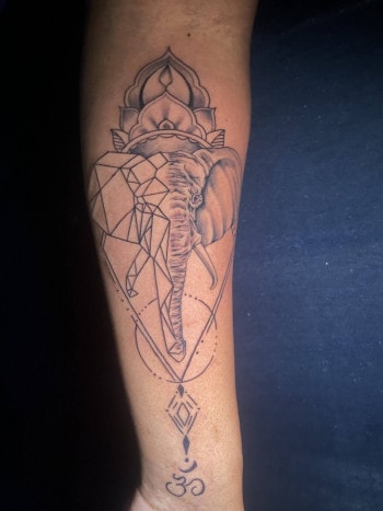 Geometric Elephant & Mandala Fine Line Tattoo By Lyric TheArtist At Iron Palm Tattoos In Atlanta, GA. Lyric mixes an impressive amount of tattoo styles together in this artistic piece. We're open late night most nights until 2AM. Call 404-973-7828 or stop by for a free consultation. Walk Ins are welcome.