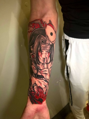 Itachi Uchiha Manga Anime Tattoo In black & red ink by Lyric TheArtist At Iron Palm Tattoos in south downtown Atlanta, GA. is a character in the Naruto manga and anime series created by Masashi Kishimoto. Itachi is the older brother of Sasuke Uchiha and is responsible for killing all the members of their clan... sparing only Sasuke. Call 404-973-7828 or stop by for a free consultation with Lyric or another Iron Palm Tattoos client. Walk Ins are welcome.
