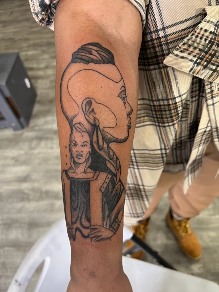 "Judah" Memorial Portrait Tattoo In Black & Grey By Funk Tha World At Iron Palm Tattoos In Atlanta Georgia. This piece was made especially to keep her sister close to her always. We're open late night until 2AM. Call 404-973-7828 or stop by for a free consultation. Walk Ins are welcome.