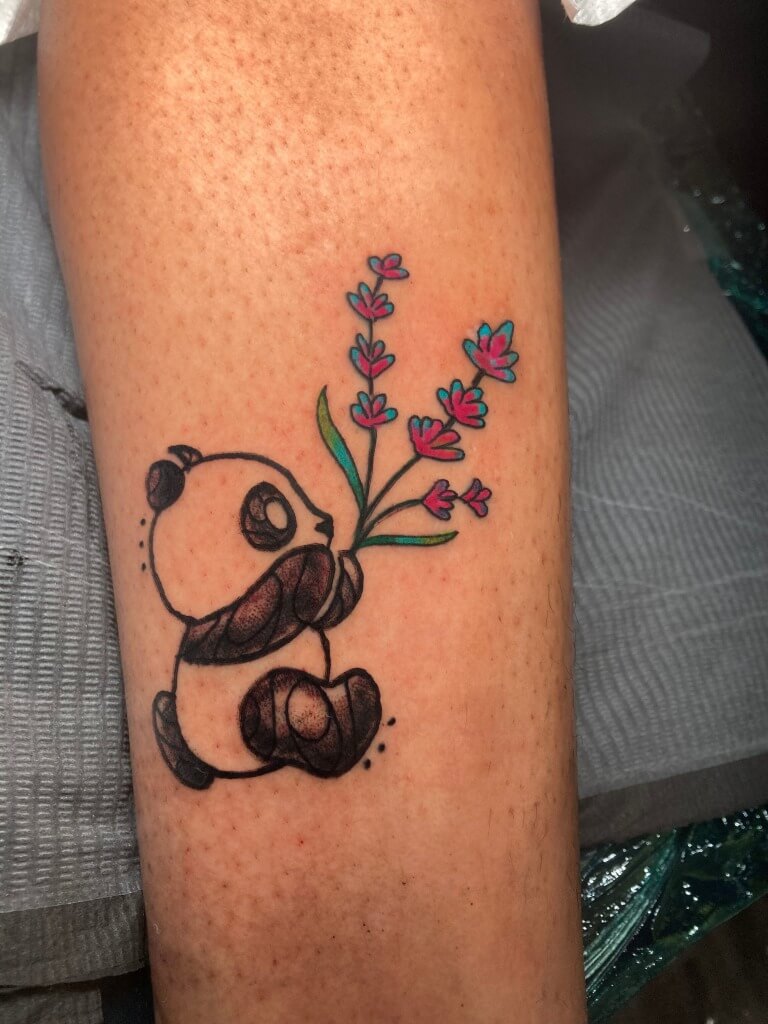 Panda Running With Flowers By Funk Tha World At Iron Palm Tattoos In Atlanta, Georgia. Call 404-973-7828 or stop by for a free consultation with Funk. Walk ins are welcome.