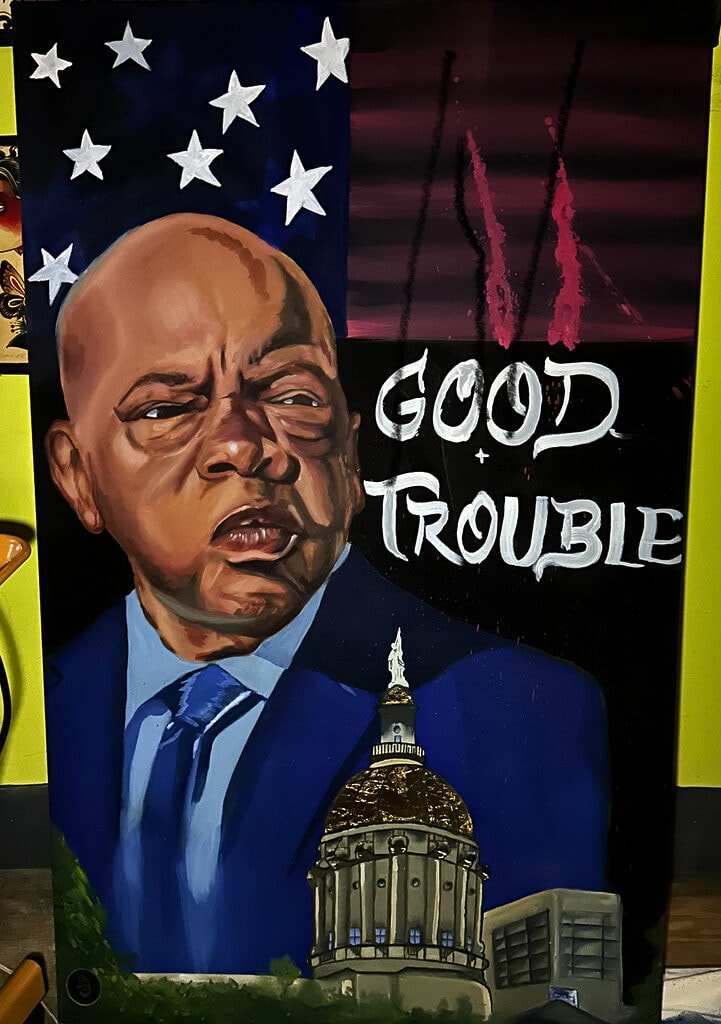 $2500 USD - "Tonton J: 'Good Trouble'" Penti pa MoE nan Iron Palm Tattoos. Marlon te pentire enspirasyon sa a kòm yon omaj bay defen senatè John Lewis la. Senatè Lewis te enpòtan nan pote chanjman pandan mouvman dwa sivil la. Youn nan pwoteje Doktè King la li te kontinye sèvi pèp li a, eta, ak peyi li jiskaske li te mouri nan biwo a.. Pyès sa a se $ 2500.00 epi yo ka achte sou entènèt sèlman sou IronPalmTattoos.com.