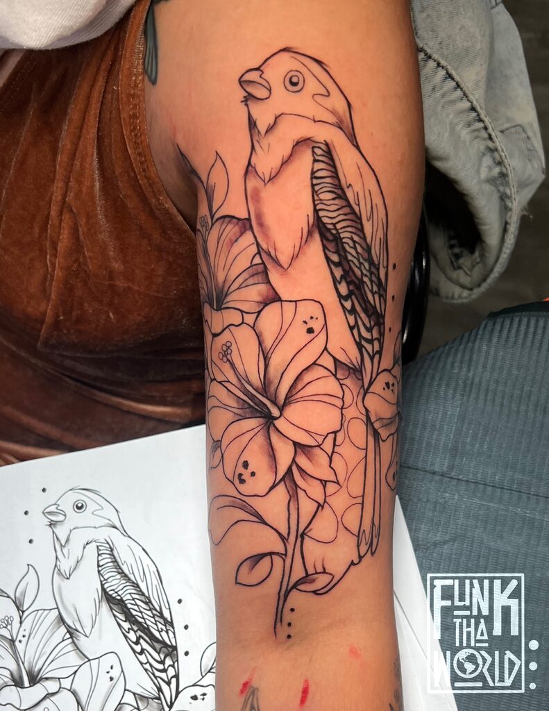 Fine Line Bird & Lotus Flower Tattoo By Funk Tha World. Funk is a senior artist at Iron Palm Tattoos. This intricate artwork seamlessly blends delicate lines to portray the beauty of a bird alongside the elegance of a lotus flower. The fusion of fine lines actually make you imagine more details than are present. What do you think? Let us know in the comments. If you're interested in acquiring a unique and expertly crafted tattoo, contact Funk at 404-973-7828 to schedule a free consultation.