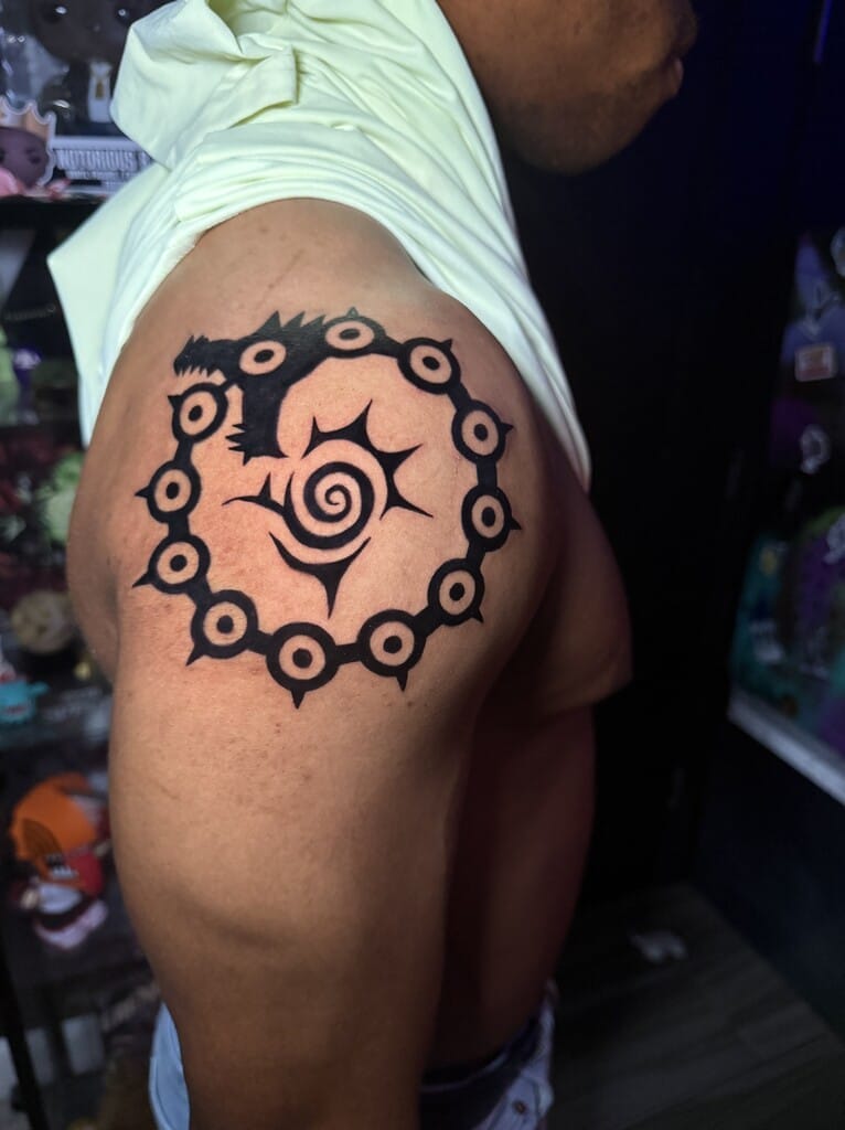 O le pe'a o le sigil o le tarako lapotopoto i luga o le tau'au ma laina mafiafia ma mamanu fa'ata'ita'i