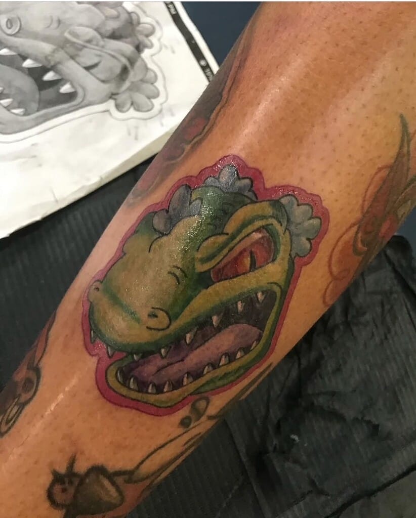tattoo ng ulo ng reptar na may kulay na kartun